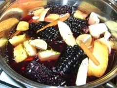 To prepare Chicha Morada just boil Peruvian purple corn, pineapple, apples, cinnamon and cloves in water