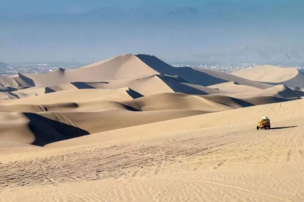 Huacachina - a true oasis surrounded by a sea of sand Huacachina - a true oasis surrounded by a sea of sand
