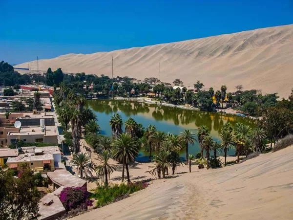 Huacachina - a true oasis surrounded by a sea of sand Huacachina - a true oasis surrounded by a sea of sand
