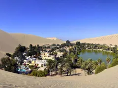 Huacachina, with a permanent population of only about 120, was built around a picture-postcard natural desert lake amid up to 200 m high sand dunes and today is the destination in Peru for dune buggying and sand boarding.