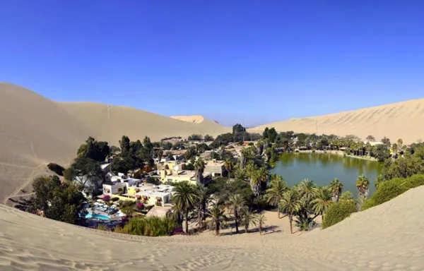 Huacachina, with a permanent population of only about 120, was built around a picture-postcard natural desert lake amid up to 200 m high sand dunes and today is the destination in Peru for dune buggying and sand boarding. Huacachina, with a permanent population of only about 120, was built around a picture-postcard natural desert lake amid up to 200 m high sand dunes and today is the destination in Peru for dune buggying and sand boarding.