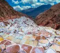 The Salt Ponds of Maras are located 50 km (about 30 miles) north-west of Cusco and about 16 km (10 miles) on road from Urubamba along the slopes of the Qaqawiñay mountain at an elevation of over 3,000 m (over 10,000 ft).